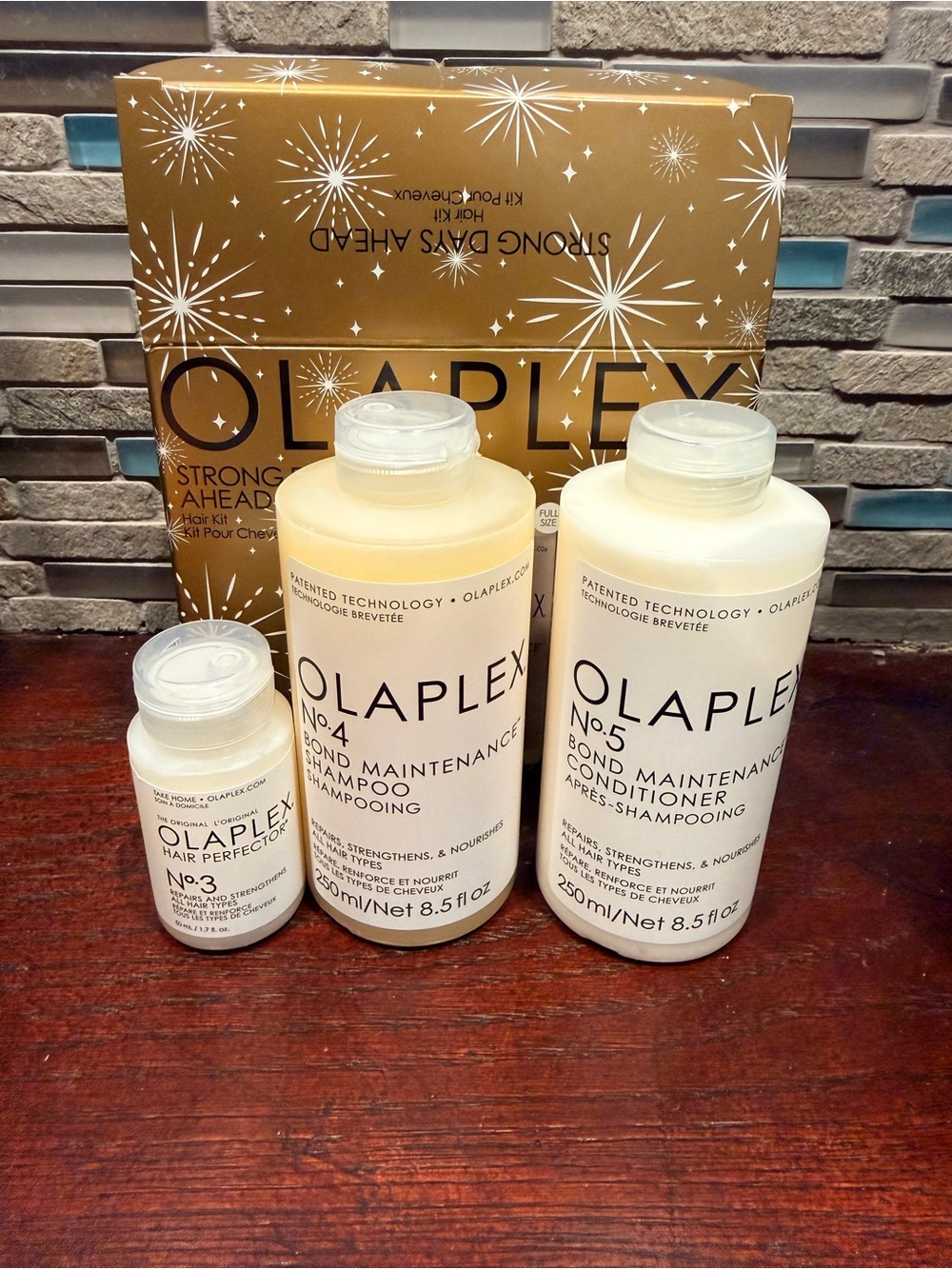 OLAPLEX Strong Days Ahead Gold Trio Pack - shampoo, conditioner, hair perfector
